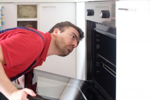 Engineer checking oven